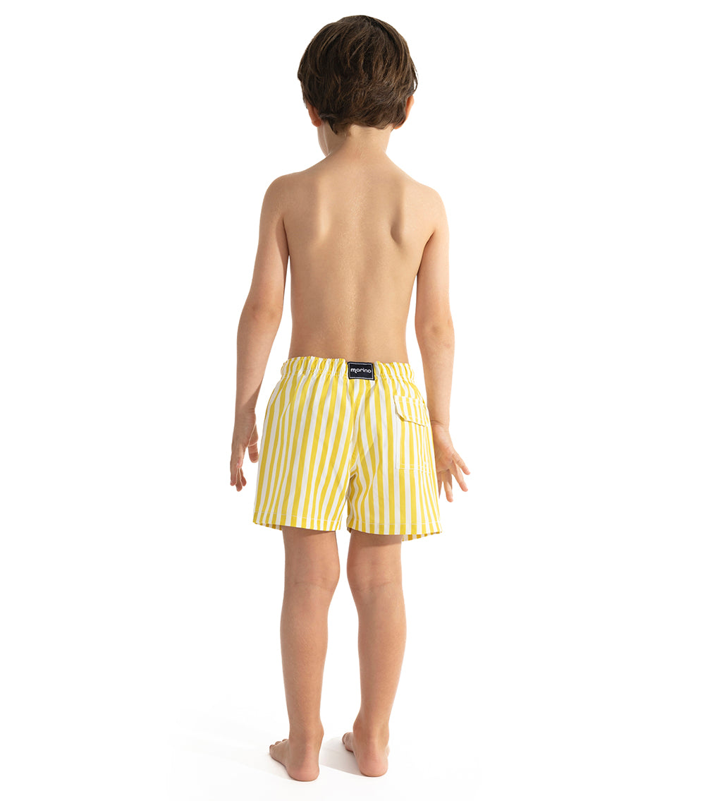 Yellow Stripes Young boy wearing yellow striped swim shorts on a white background