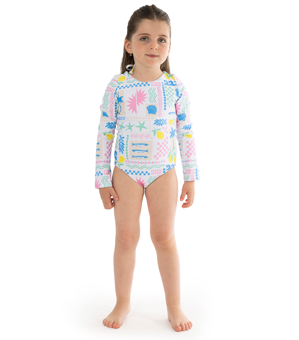 Capri White Child wearing a colorful long-sleeve swimsuit with a pattern on a white background