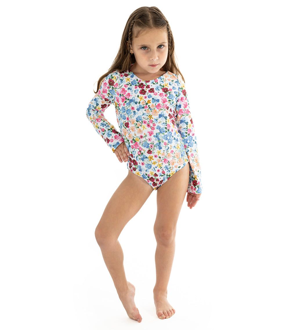 Flowers Young girl wearing a floral long-sleeve swimsuit on a white background