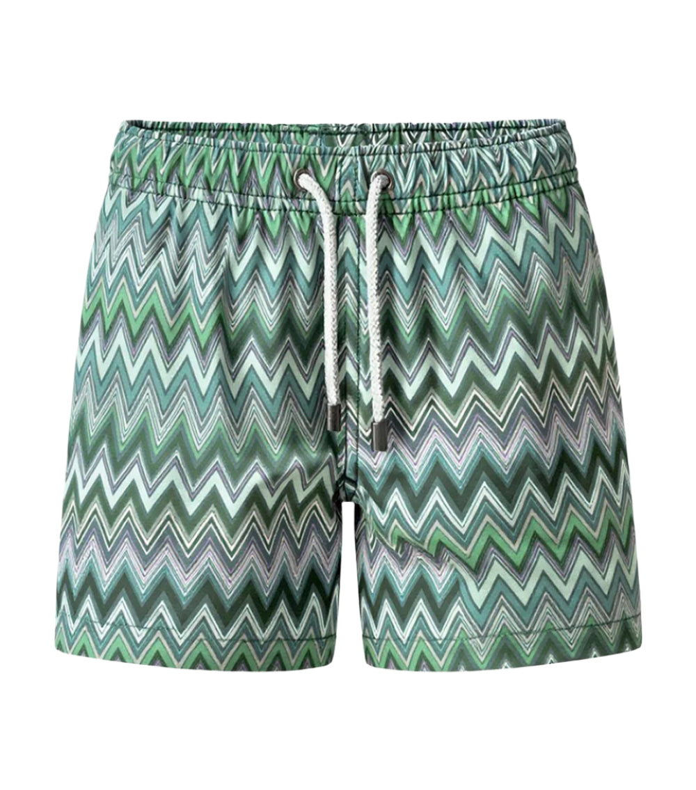 Chevron Man wearing green and white zigzag patterned shorts on a white background