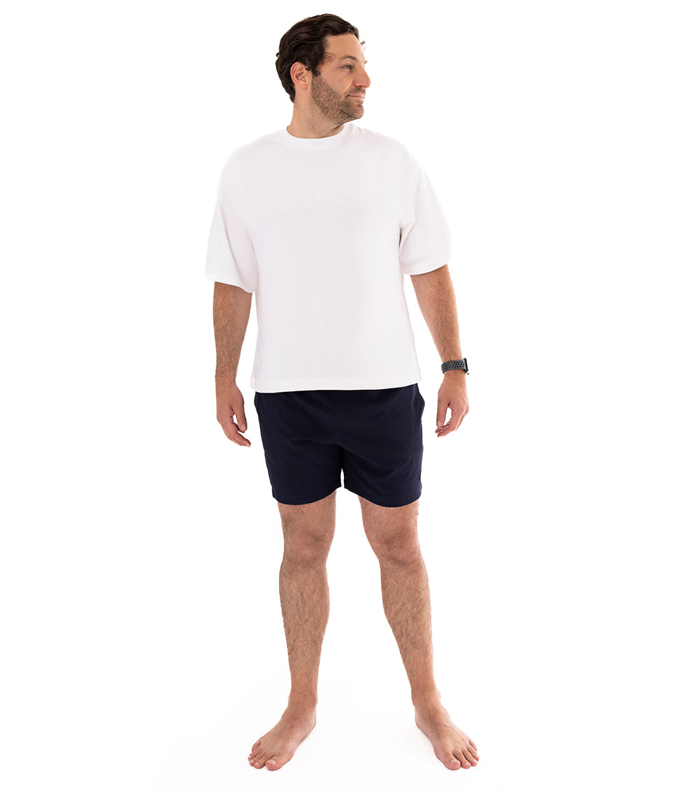 Navy Man wearing navy shorts on a white background