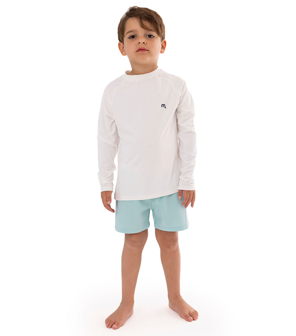 White boy wearing white rashguard dryfit with aqua blue shorts