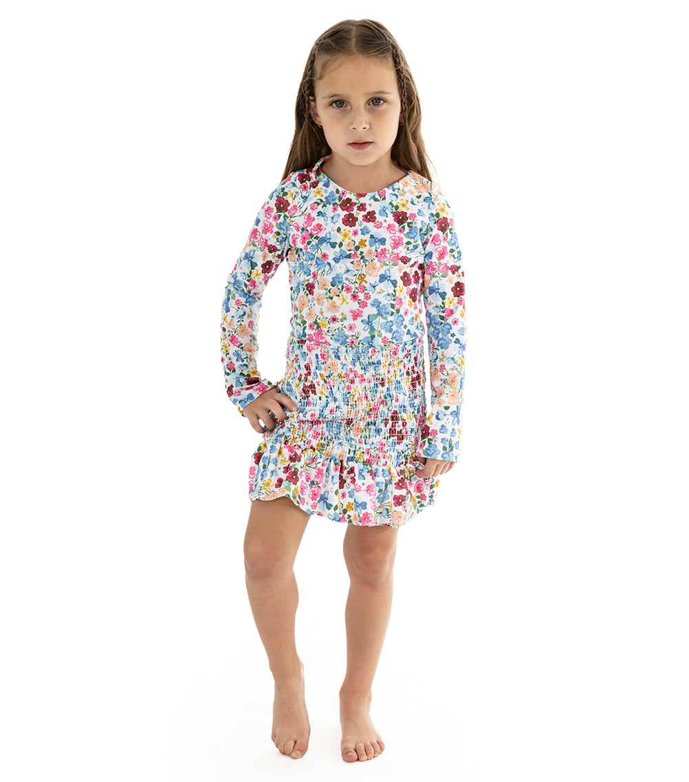 Flowers young girl wearing floral swimsuit with matching skirt