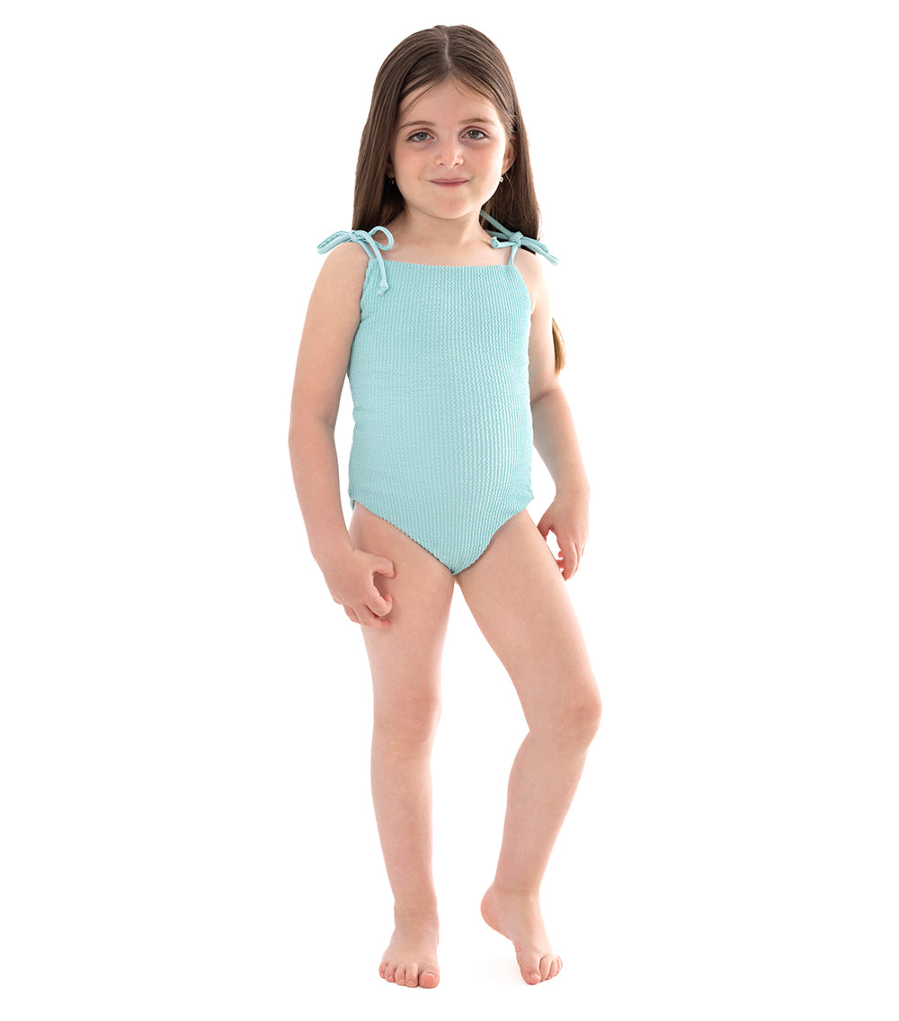 Aqua Young girl wearing a light blue swimsuit on a white background