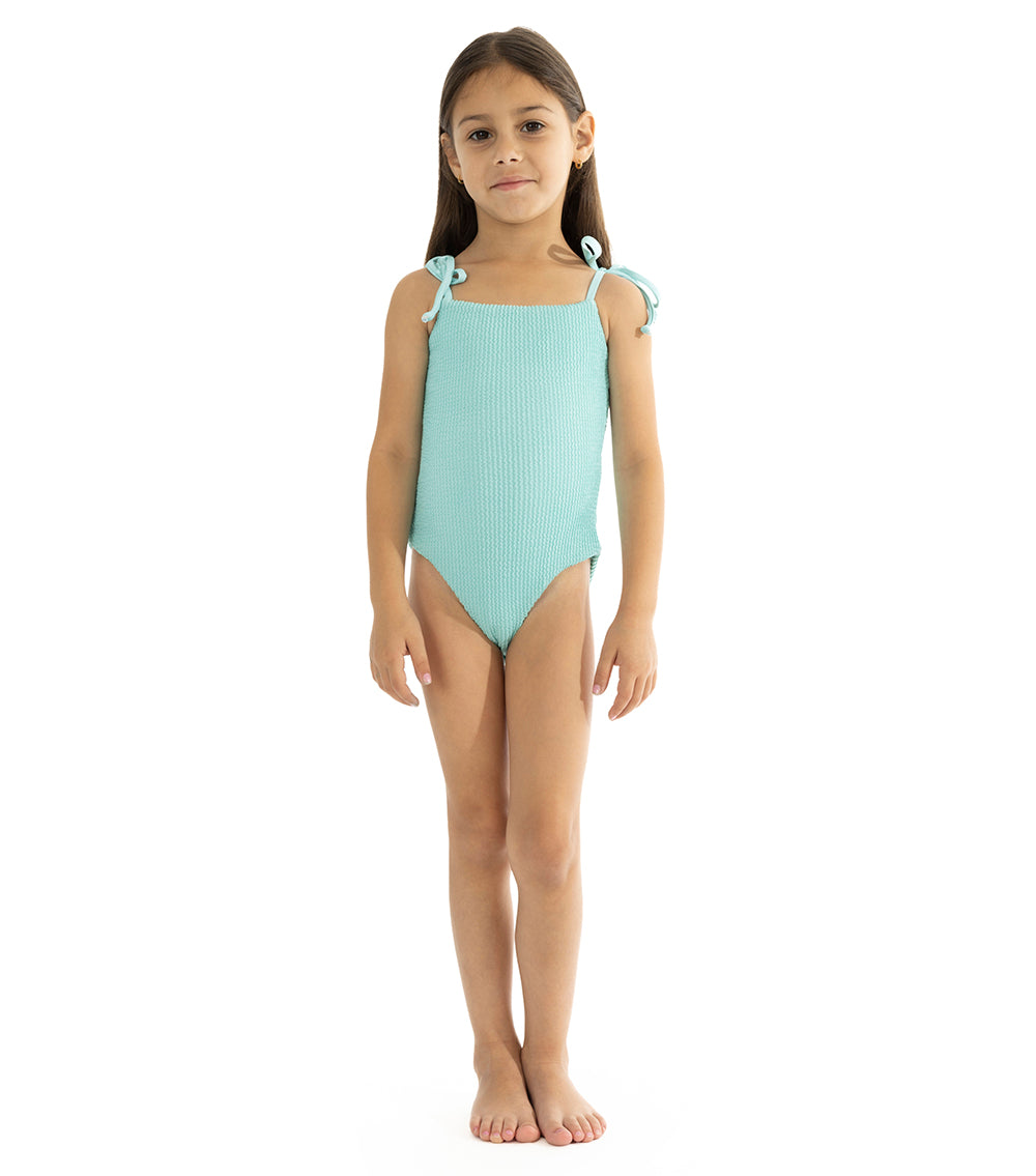 Aqua Young girl wearing a light blue swimsuit on a white background
