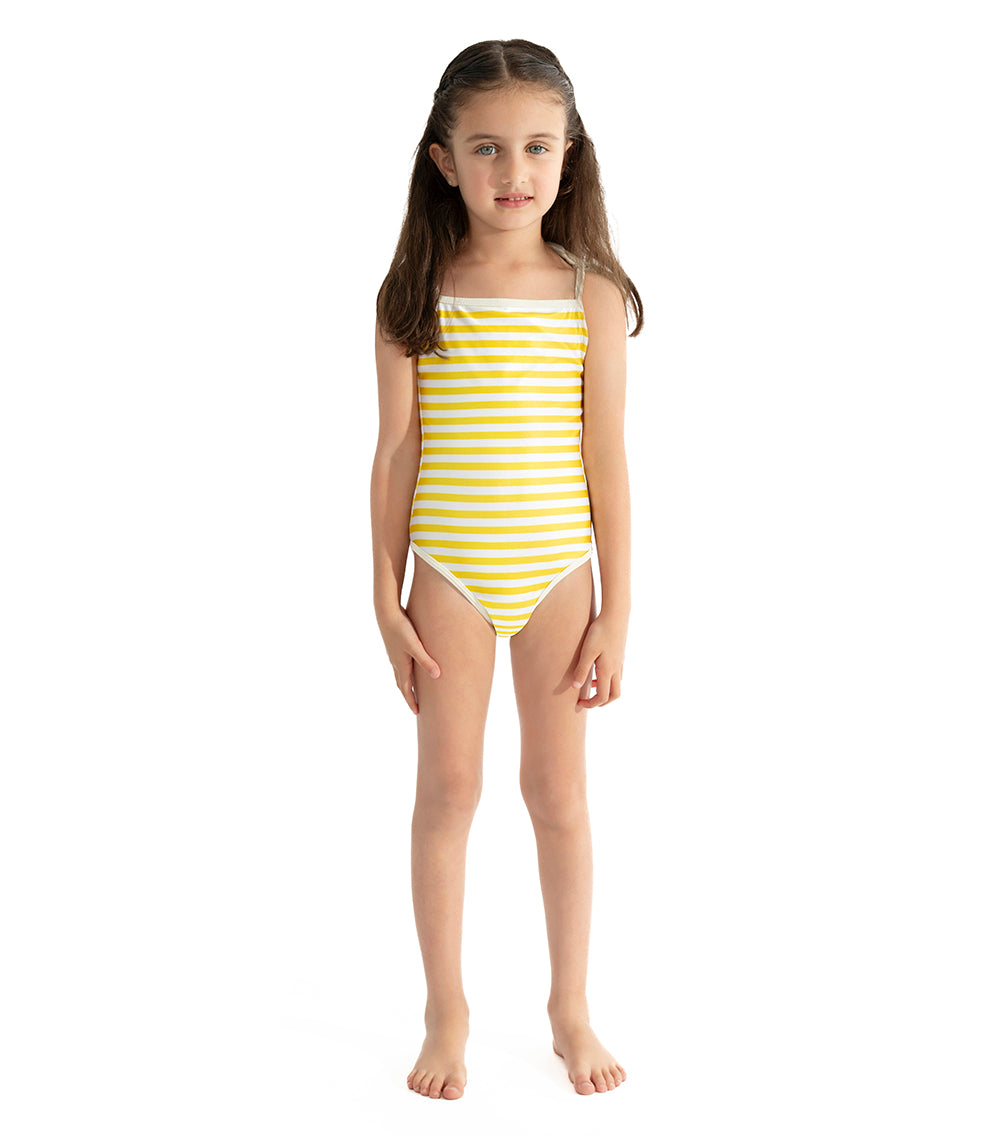 Yellow Stripes Young girl wearing a yellow and white striped swimsuit on a white background