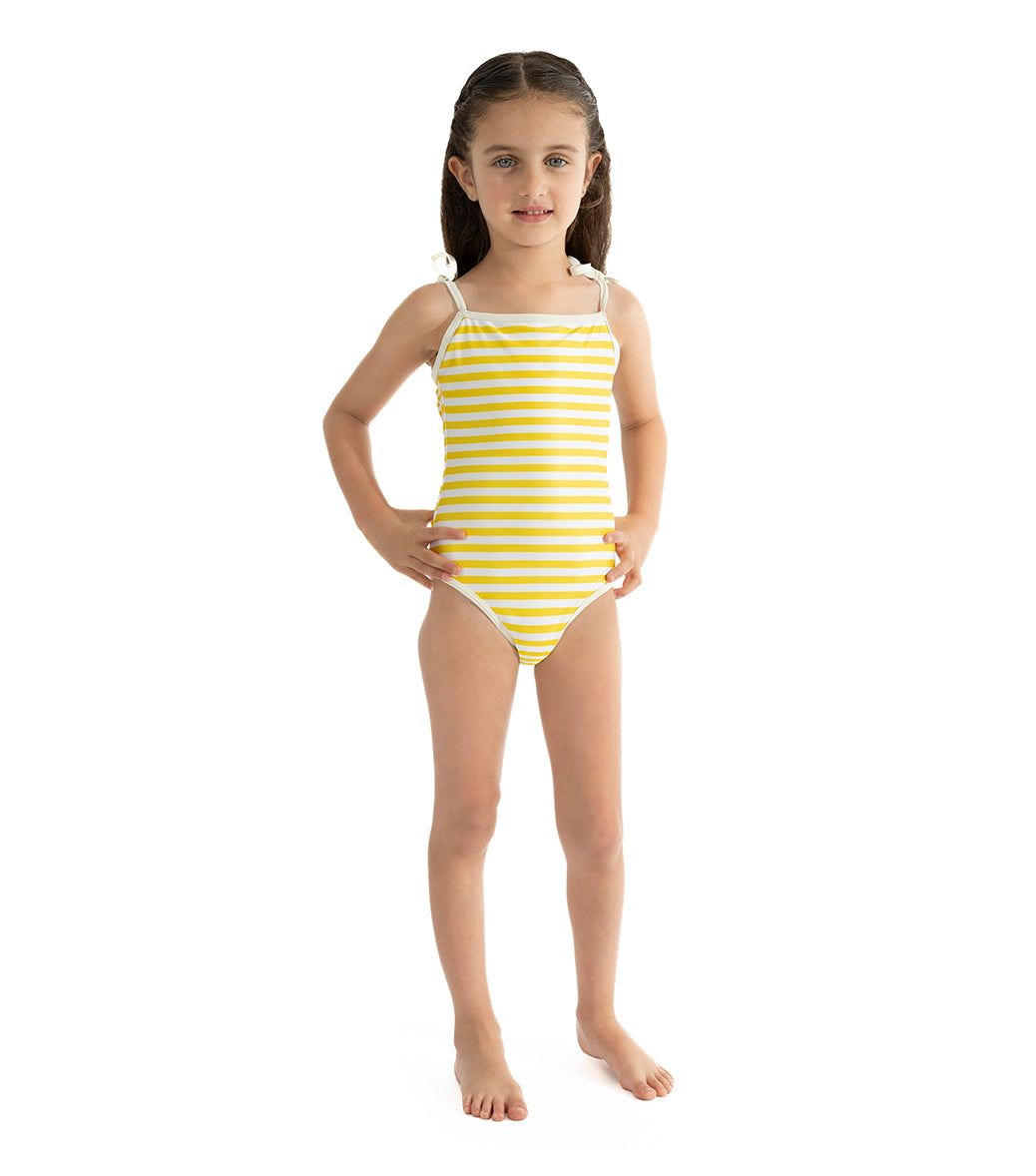 Yellow Stripes Young girl wearing a yellow and white striped swimsuit on a white background