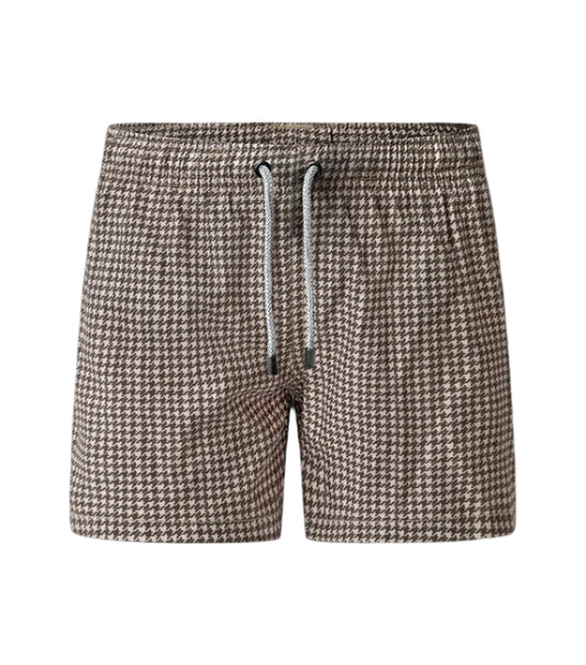 Houndstooth patterned shorts with a drawstring on a white background