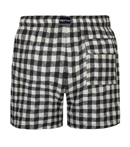Gingham Black and white checkered shorts with a brand label on a white background
