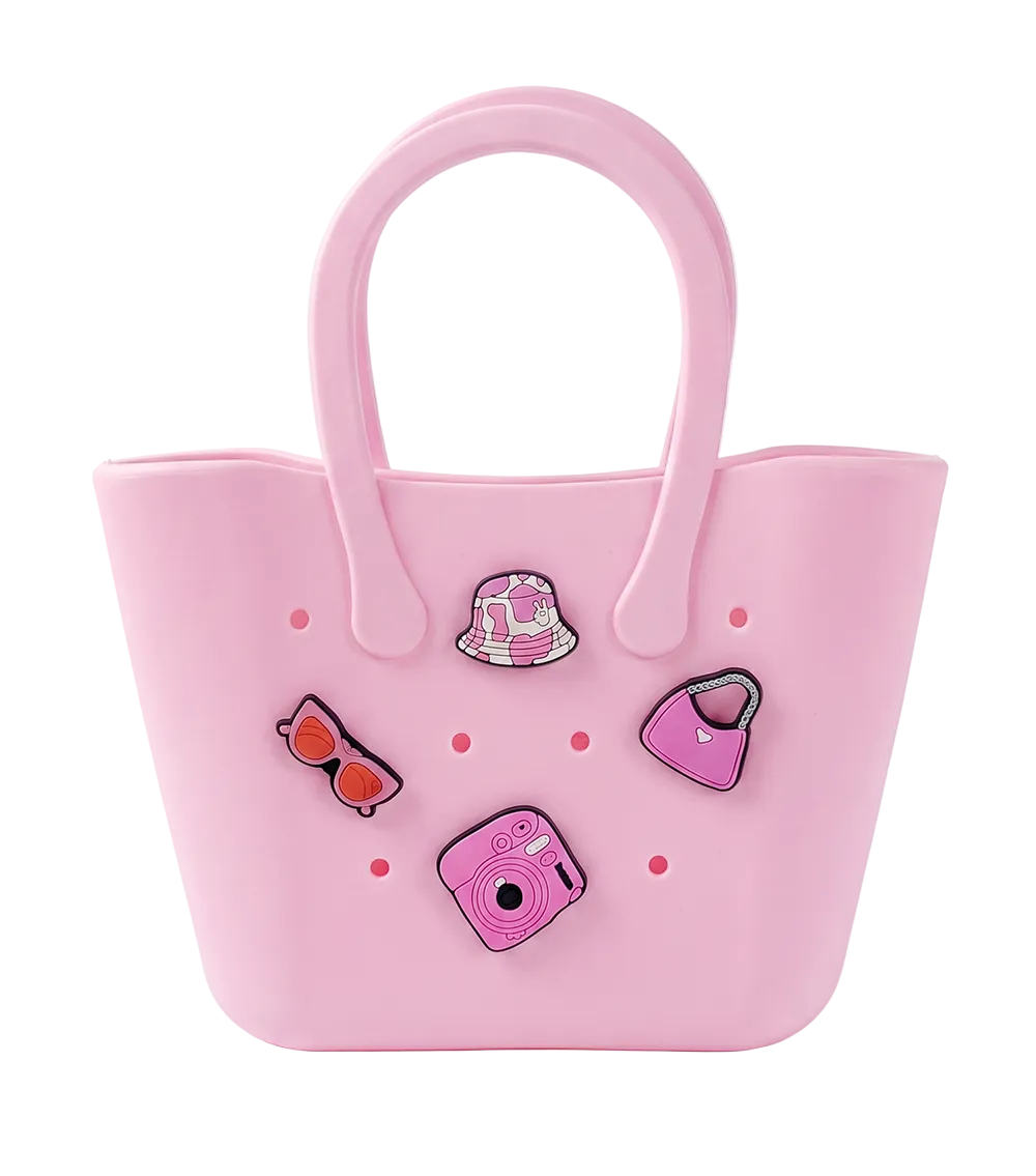 Pink silicone bag with decorative pins on a white background