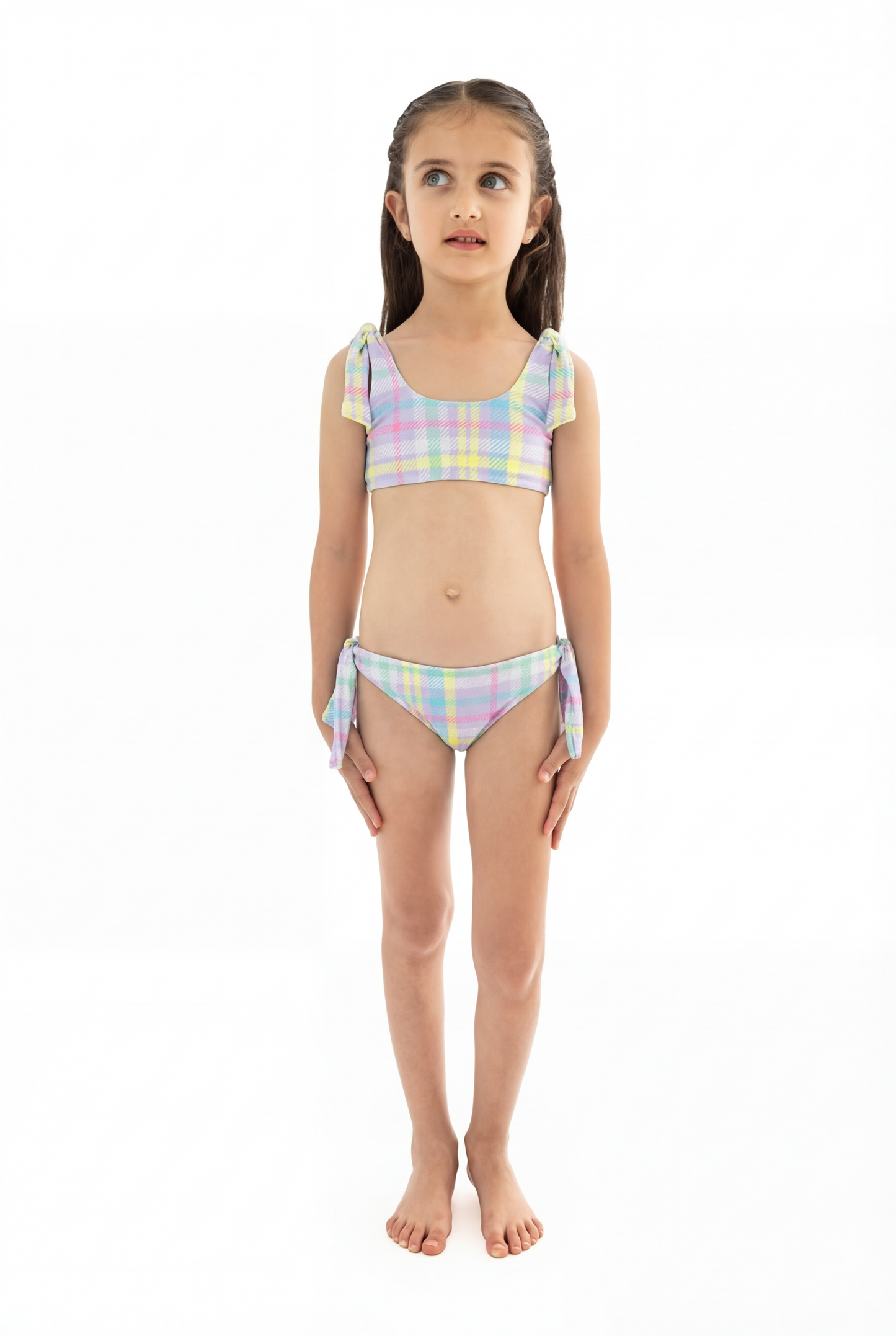 purple plaid Young girl wearing a pastel plaid bikini set on a white background