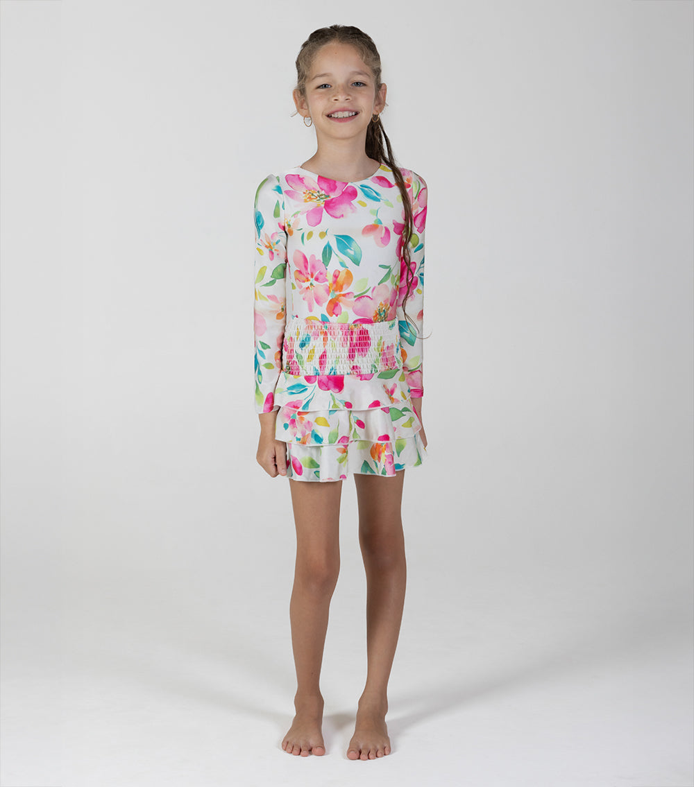 aquarella flowers Young girl wearing a floral long-sleeve shirt and shorts set on a white background