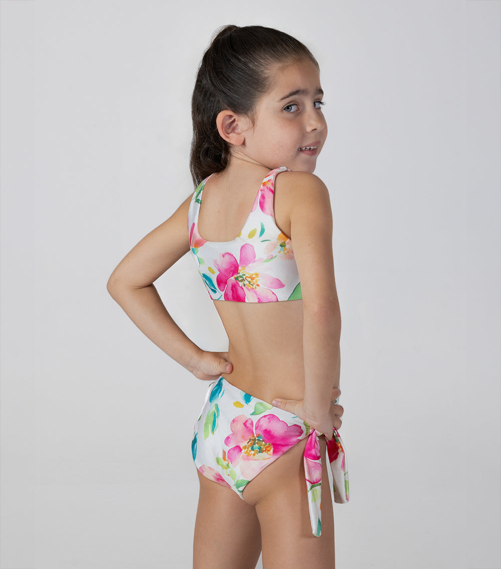 aquarella flowers Young girl wearing a colorful floral bikini against a plain background