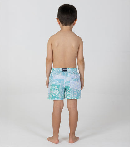 paisley Child wearing a turquoise patterned swim trunk on a white background