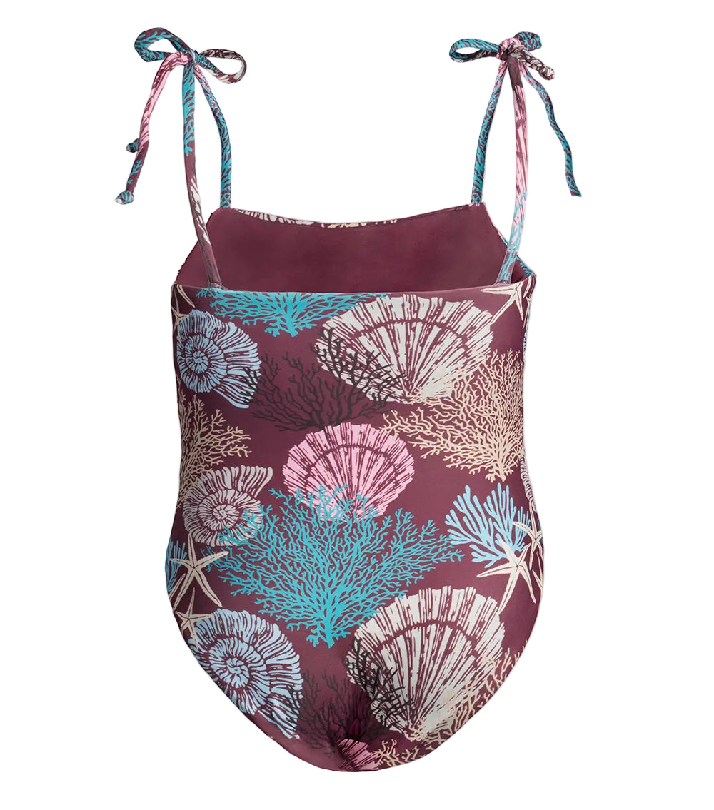One-piece swimsuit with shell and burgundy corals pattern on a white background