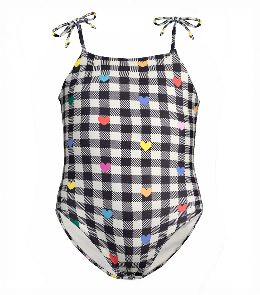 gingham emoji Black and white checkered swimsuit with colorful heart patterns on a light gray background